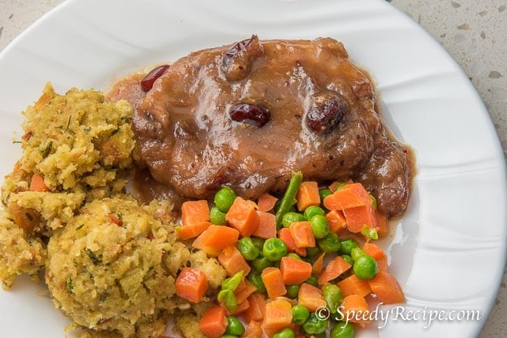 Apple Cranberry Pork Chop with Stuffing and Mixed Veggies