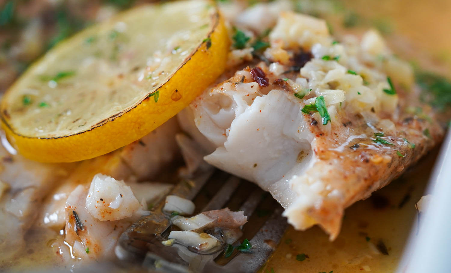 Garlic Butter Baked Tilapia on Fork Close-Up